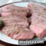 Perfectly Tender Sous Vide Tri Tip 6 Sliced sous vide tri tip on white plate