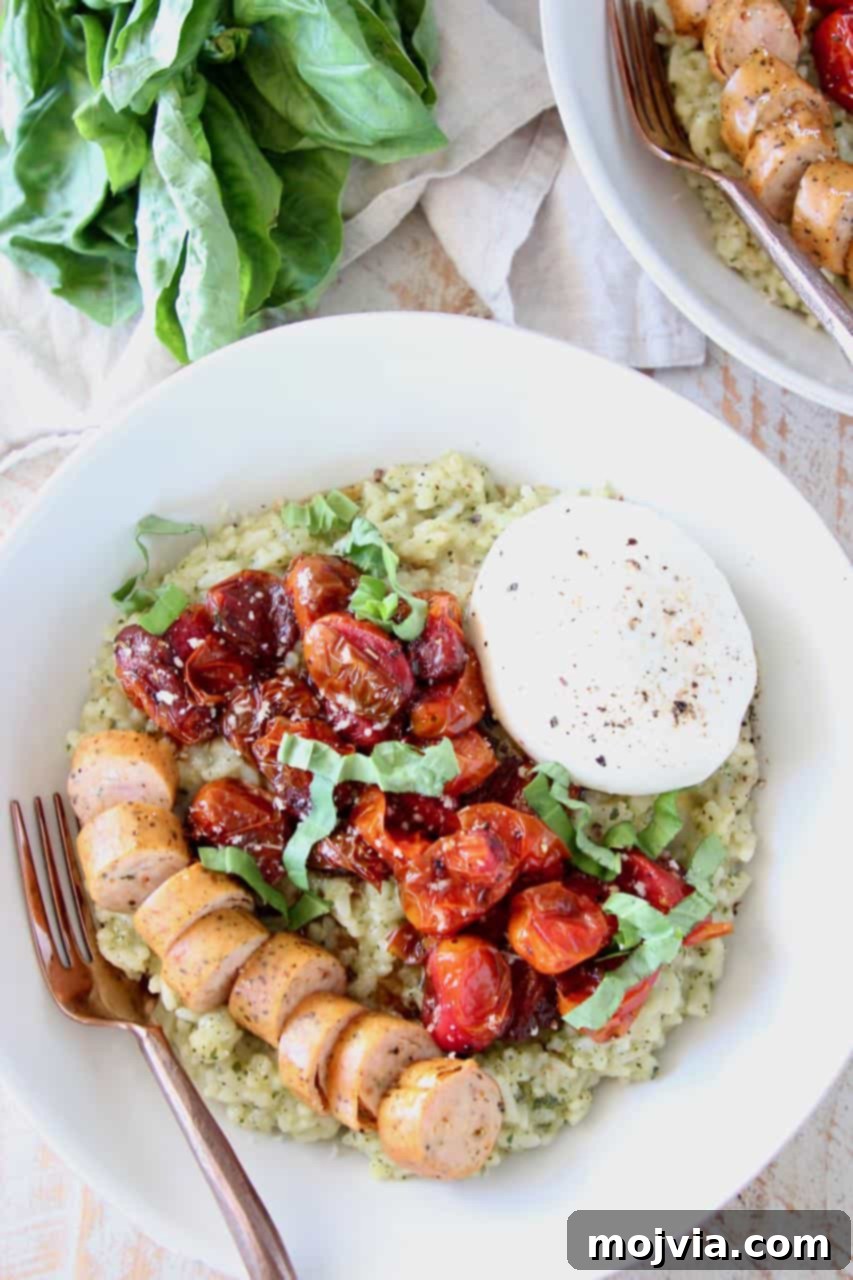 Creamy Instant Pot Pesto Risotto 2 Creamy Instant Pot Pesto Risotto topped with roasted cherry tomatoes, sliced Italian sausage, and fresh burrata cheese in a rustic bowl