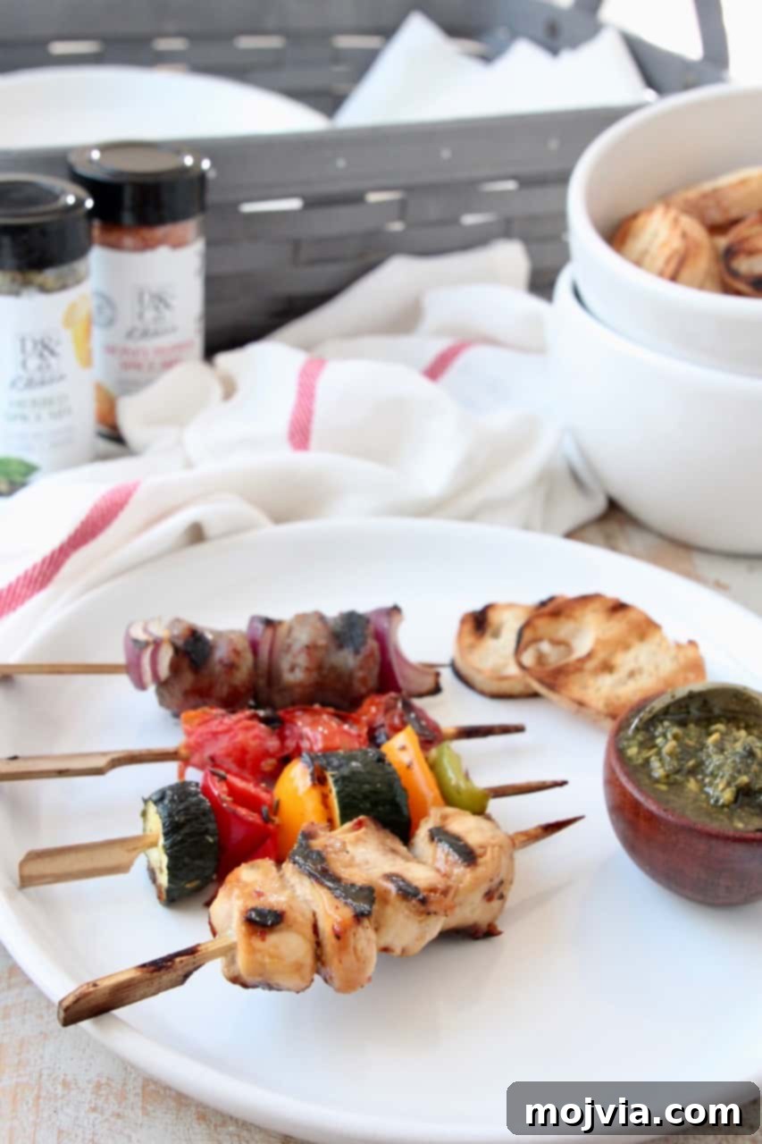 Grilled Bites Charcuterie Board 7 Grilled mini skewers with a side of basil pesto and toasted bread on a rustic plate
