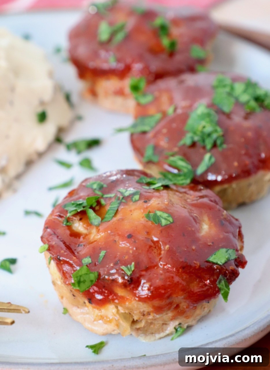 Flavorful mini meatloaves served on a plate, ready to enjoy for dinner.