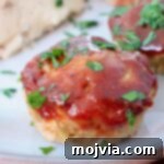 Mini meatloaf glazed with bbq sauce on plate