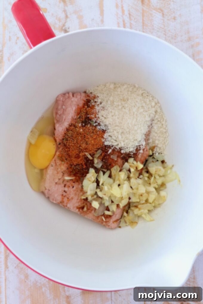 Meatloaf ingredients gathered in a large mixing bowl, ready to be combined.
