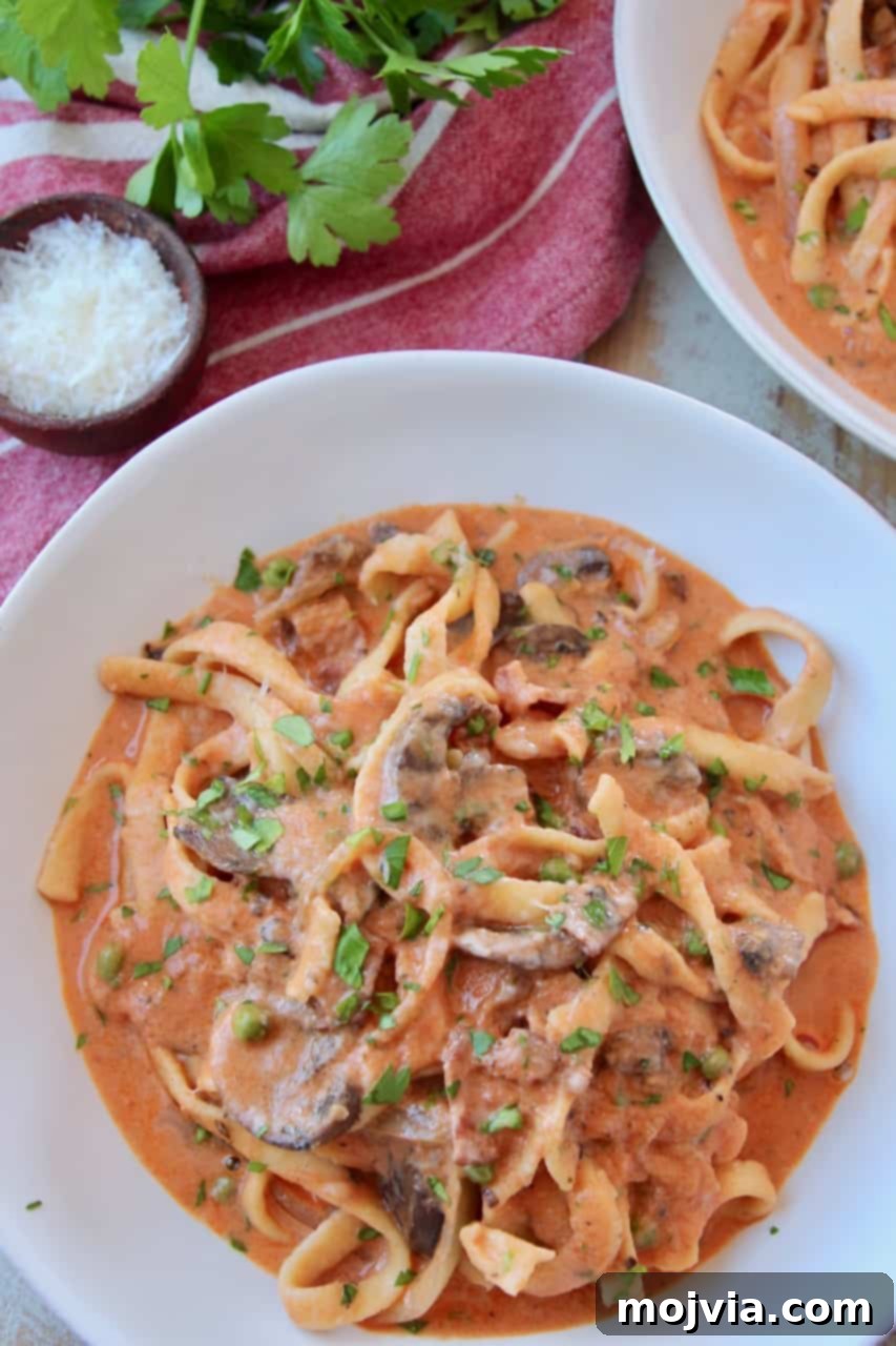 Pasta Boscaiola: Creamy Forest Mushrooms & Smoked Bacon 5 Pasta in creamy tomato sauce in bowl