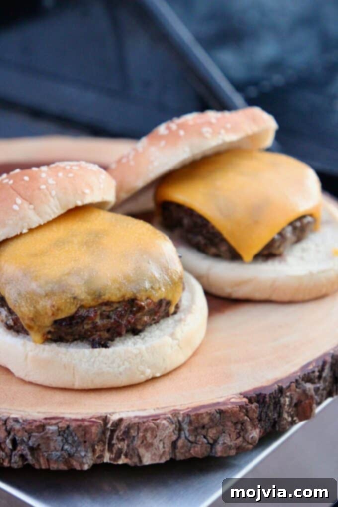 Grill Like a Pro: 10 Secrets for Perfect Flavor 5 Juicy grilled cheeseburgers on a wooden cutting board, ready to serve