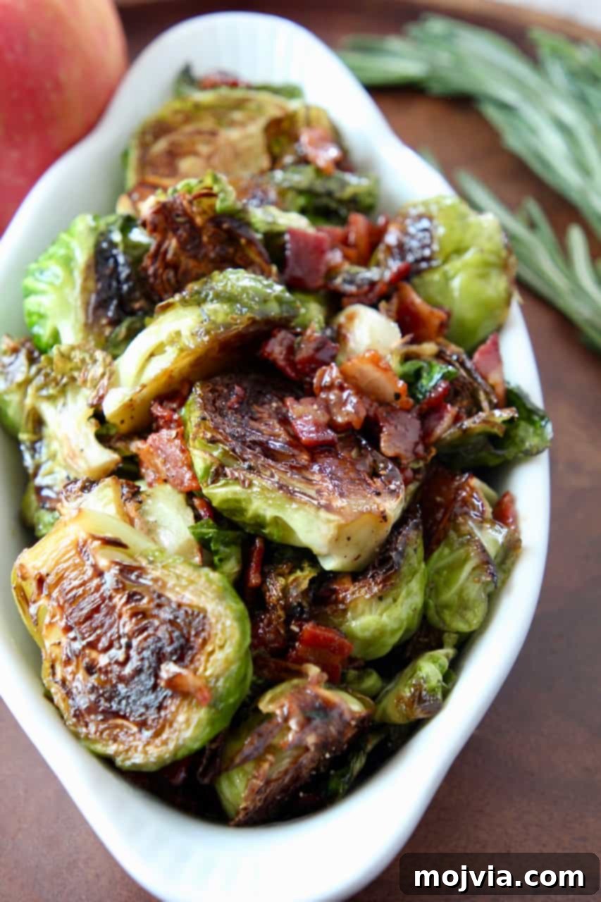 Roasted Maple Bacon Brussels Sprouts 2 cooked brussels sprouts in dish with cooked bacon