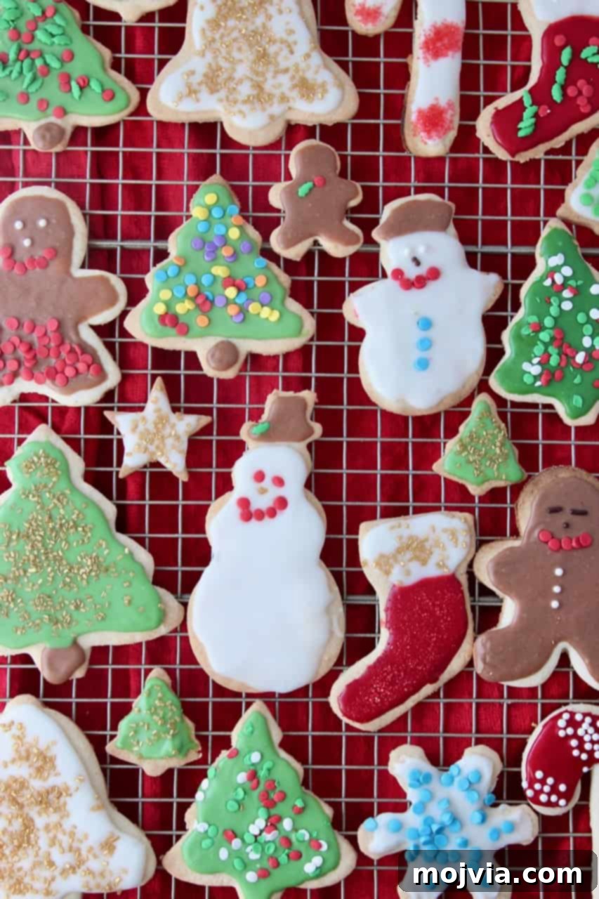 overhead image of decorated sugar cookies on metal baking rack