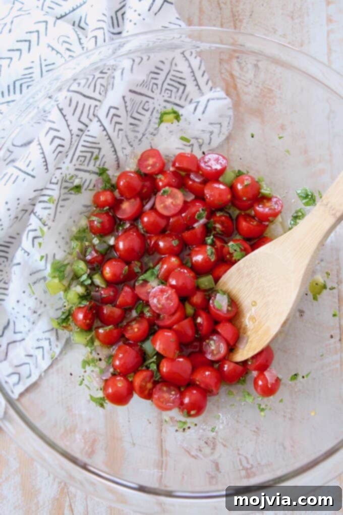 Bright Mediterranean Orzo Salad 6 Halved grape tomatoes added to the lemon herb dressing mixture.
