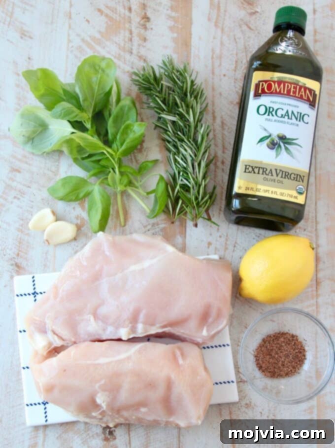 Bright Lemon & Rosemary Chicken 3 overhead image of fresh ingredients laid out for lemon rosemary chicken breasts