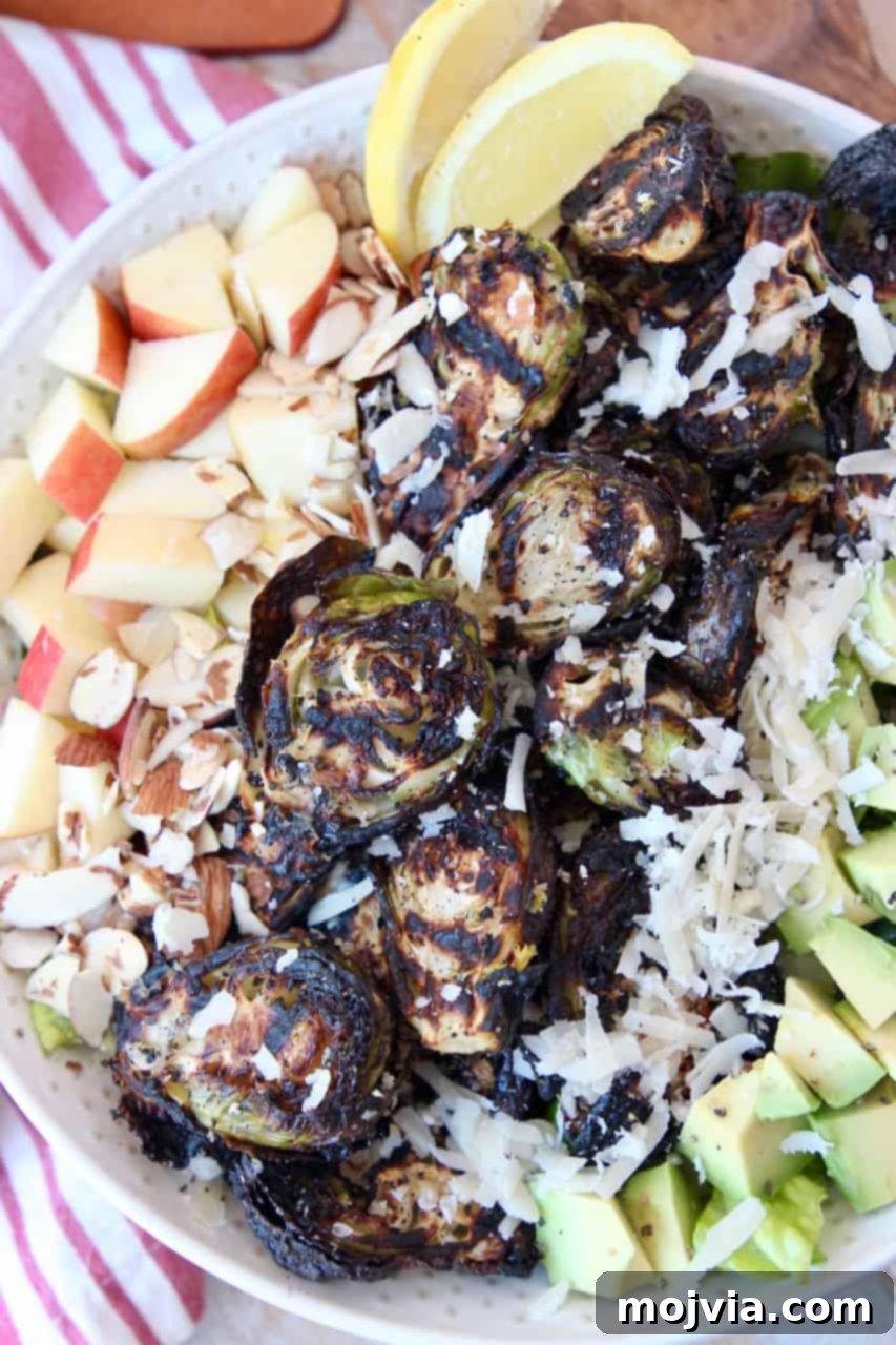 Fire-Kissed Brussels Sprouts 5 grilled brussels sprouts in bowl with salad