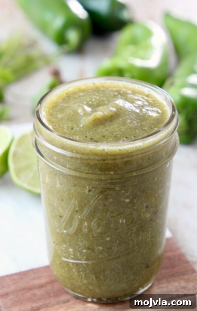 Vibrant Verde Enchilada Sauce 5 A pristine mason jar filled with freshly made green enchilada sauce, illustrating its smooth texture and rich color, ready for use.