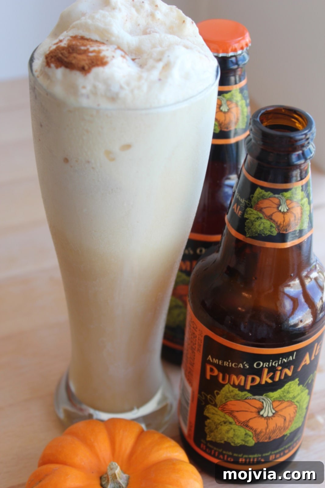 Delicious Pumpkin Ale Ice Cream Float in a tall glass, garnished with cinnamon.