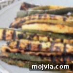 Summer Grilled Zucchini 6 grilled zucchini spears on plate