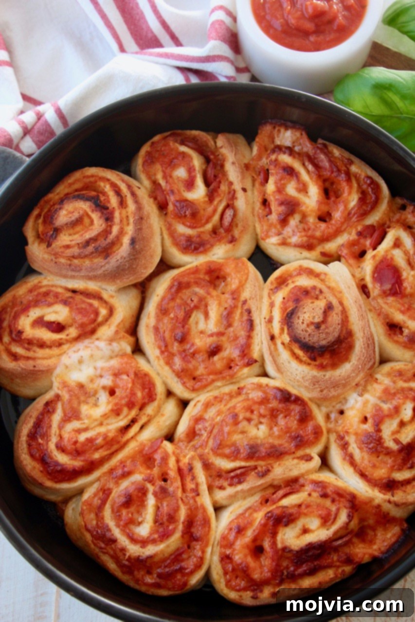 Crispy Pizza Bites 2 cooked pizza rolls in pan