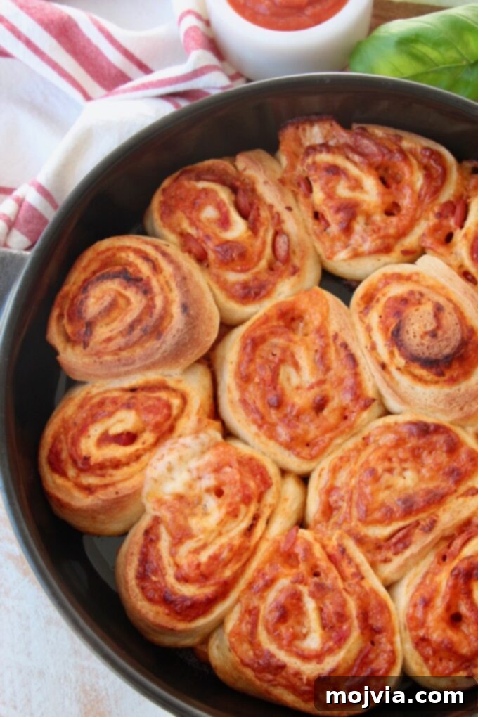 Crispy Pizza Bites 8 pizza rolls in black baking dish