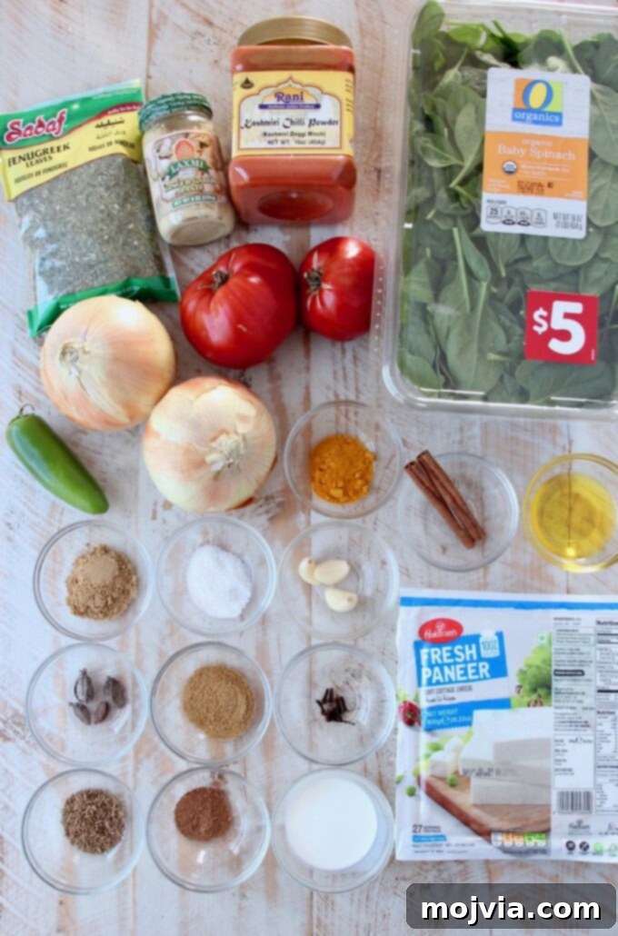 Spinach Paneer Curry 3 A vibrant display of fresh ingredients laid out for Palak Paneer preparation.