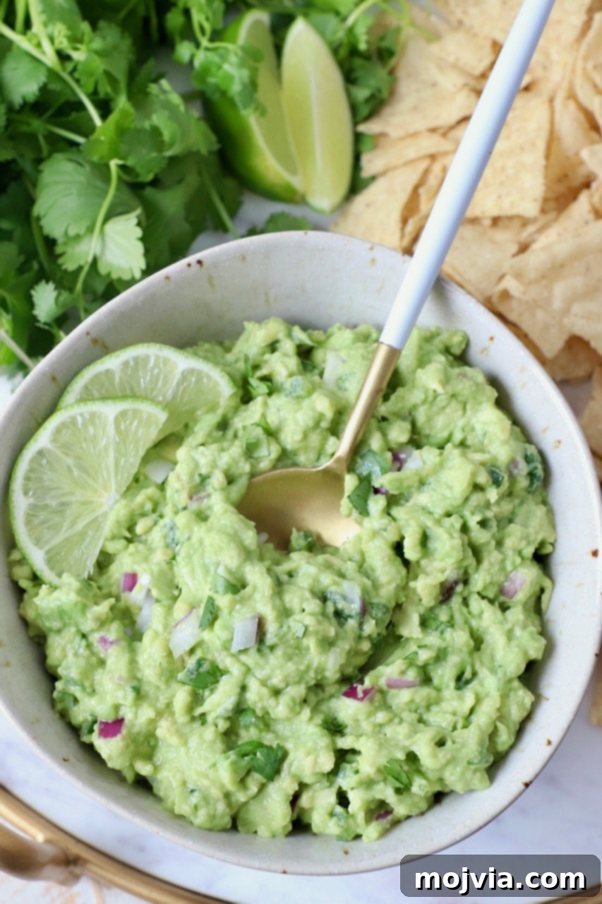 guacamole in bowl with spoon