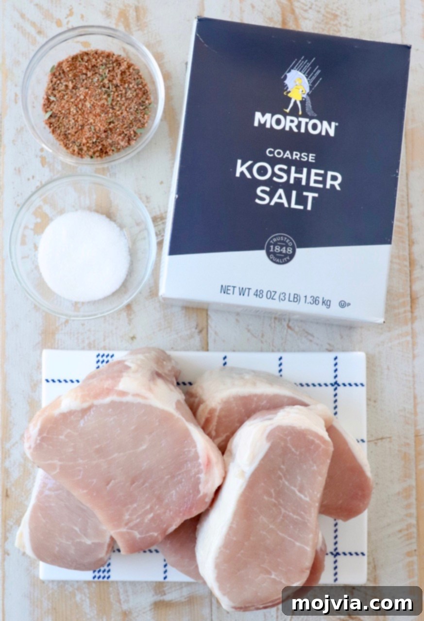 Artisan Smoked Pork Chops 3 Close-up of fresh ingredients for smoked pork chops, including thick-cut pork, salt, sugar, and spices, on a rustic wooden board.