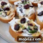 Creamy Goat Cheese and Tart Cranberry Crostini 7 goat cheese and dried cranberry crostini on a plate