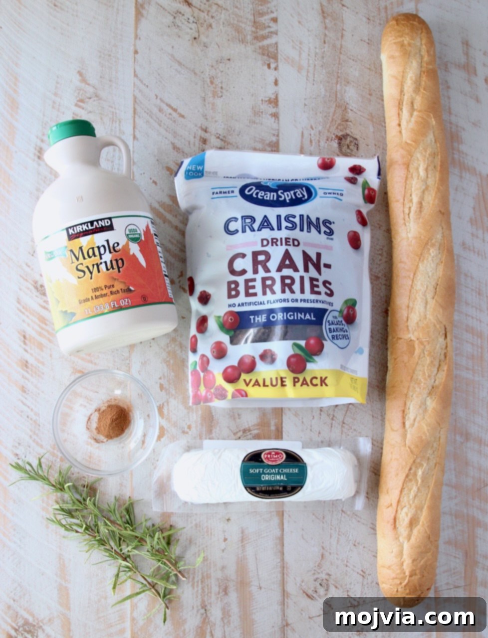 Creamy Goat Cheese and Tart Cranberry Crostini 3 ingredients for cranberry goat cheese crostini on a white wood board