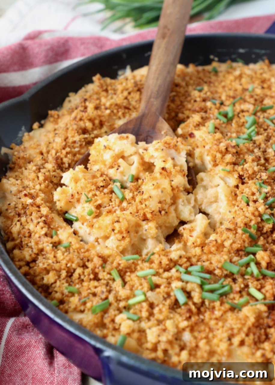 Velvet Smoke Mac 2 smoked mac and cheese in skillet with serving spoon