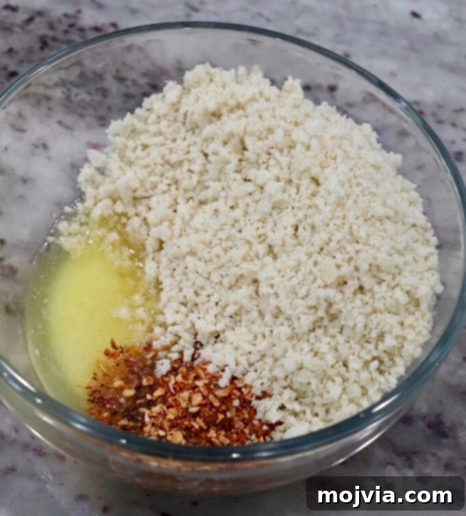 Velvet Smoke Mac 13 panko breadcrumbs with melted butter and seasonings in glass bowl