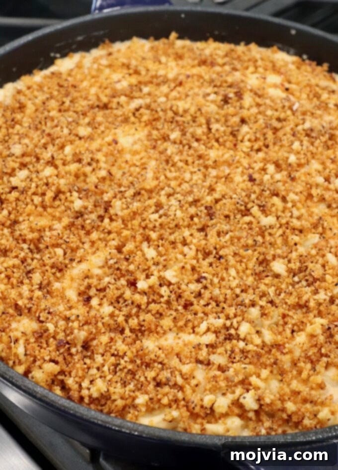 Velvet Smoke Mac 15 mac and cheese in skillet with panko breadcrumb topping