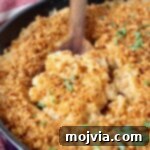 Velvet Smoke Mac 20 mac and cheese in skillet with serving spoon