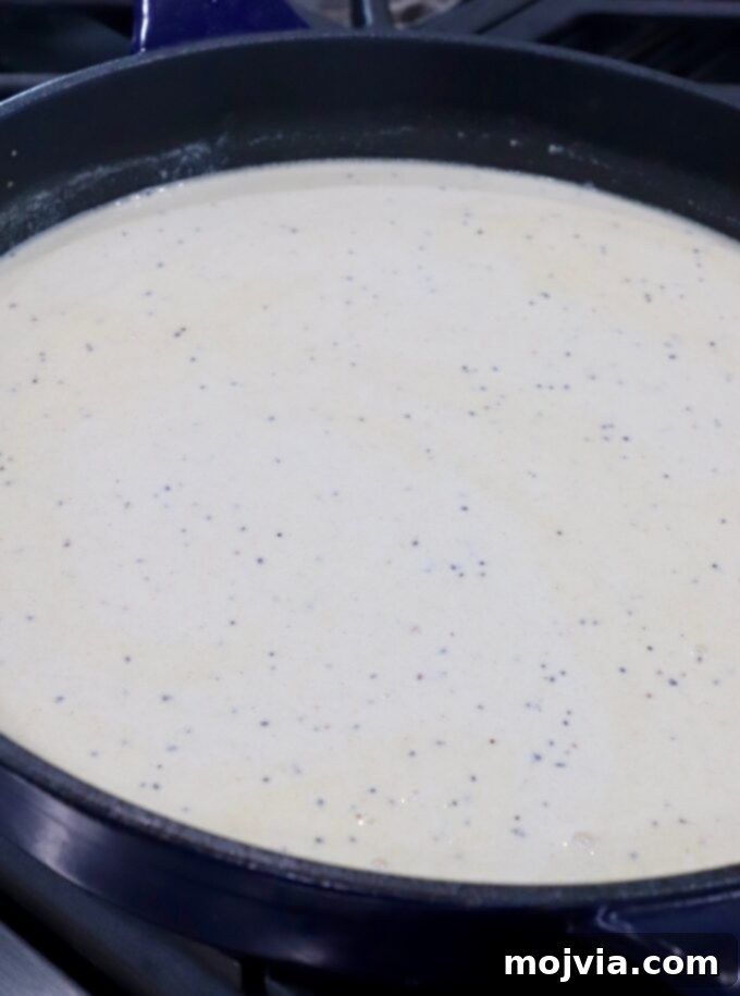 Velvet Smoke Mac 7 creamy sauce in skillet on stove