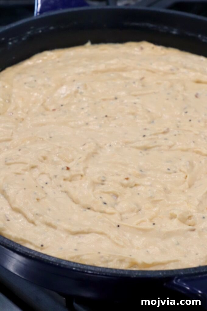Velvet Smoke Mac 10 cheesy sauce in skillet on stove
