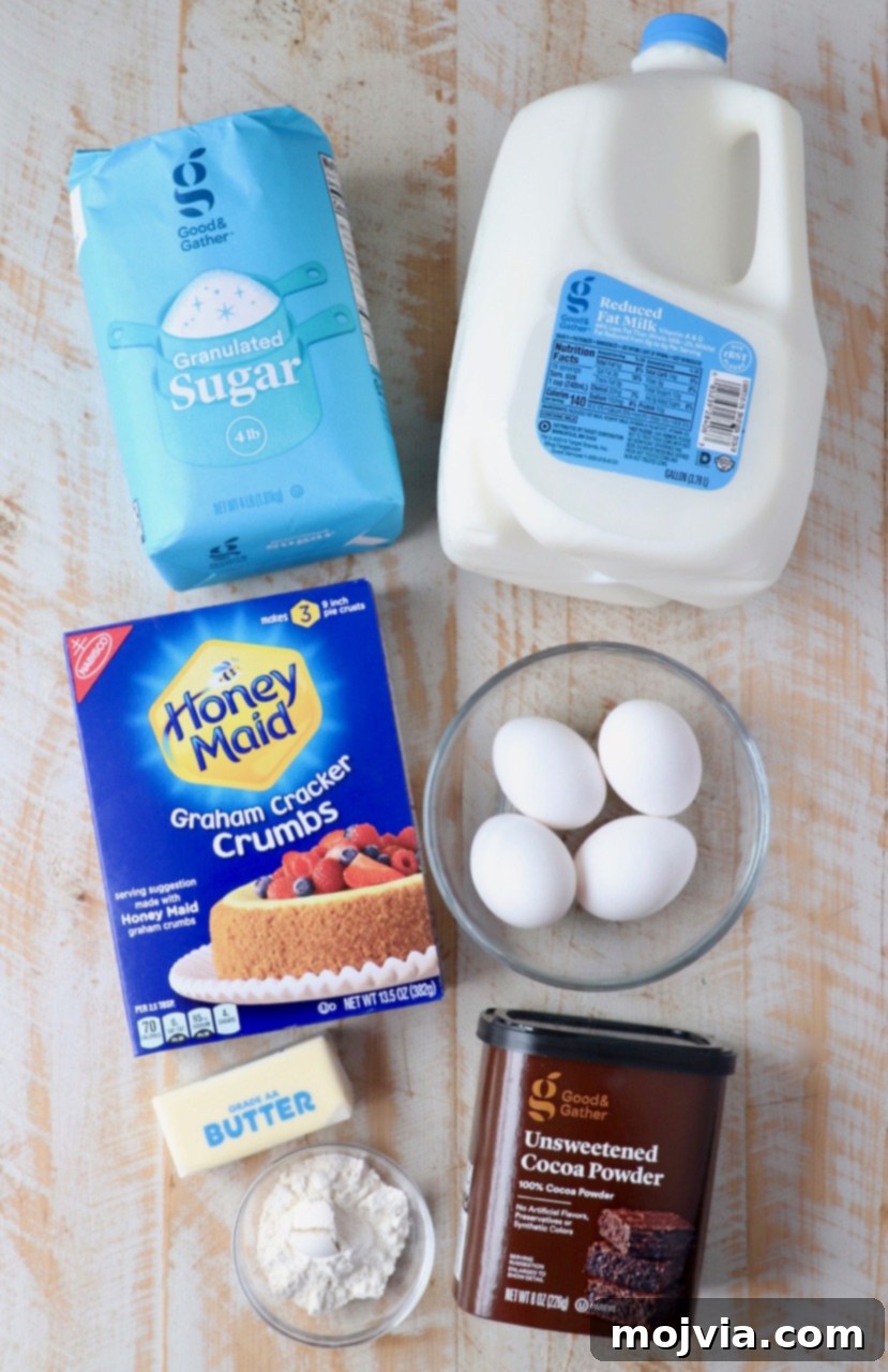 All the essential ingredients neatly laid out for making Meme's famous chocolate pie, including graham cracker crumbs, cocoa powder, milk, eggs, and heavy cream for the luscious whipped topping.
