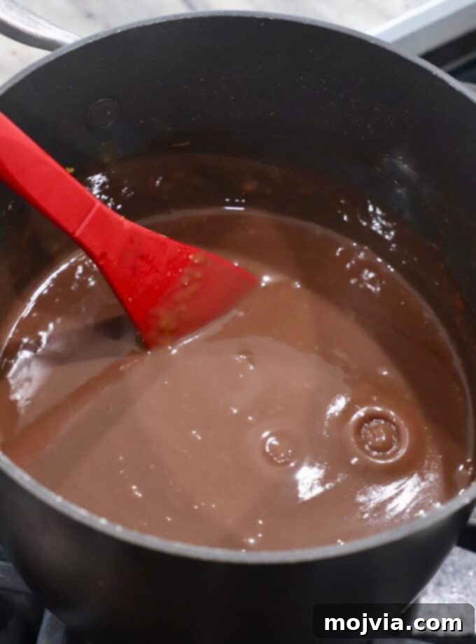The chocolate pie filling in the saucepan, now wonderfully thick and creamy, ready for the final touch.