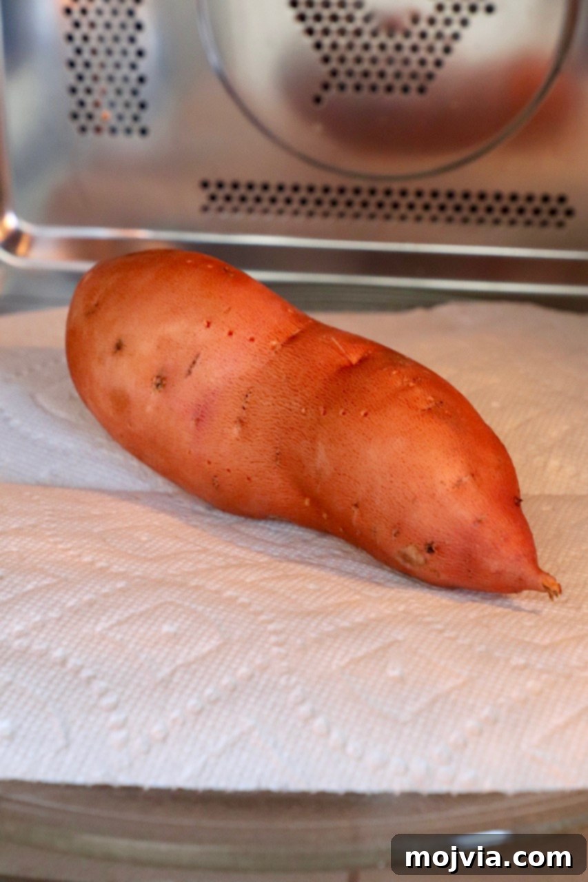 Sweet Potato Perfection Every Time 3 sweet potato being microwaved on a paper towel for quick cooking