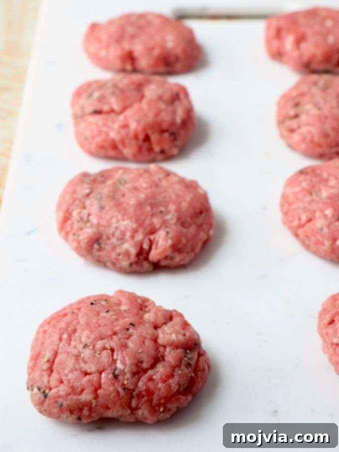 ground beef slider patties on cutting board