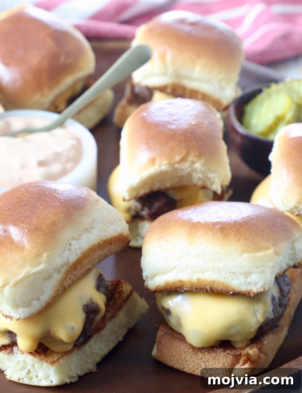 cheeseburger sliders on wood serving tray