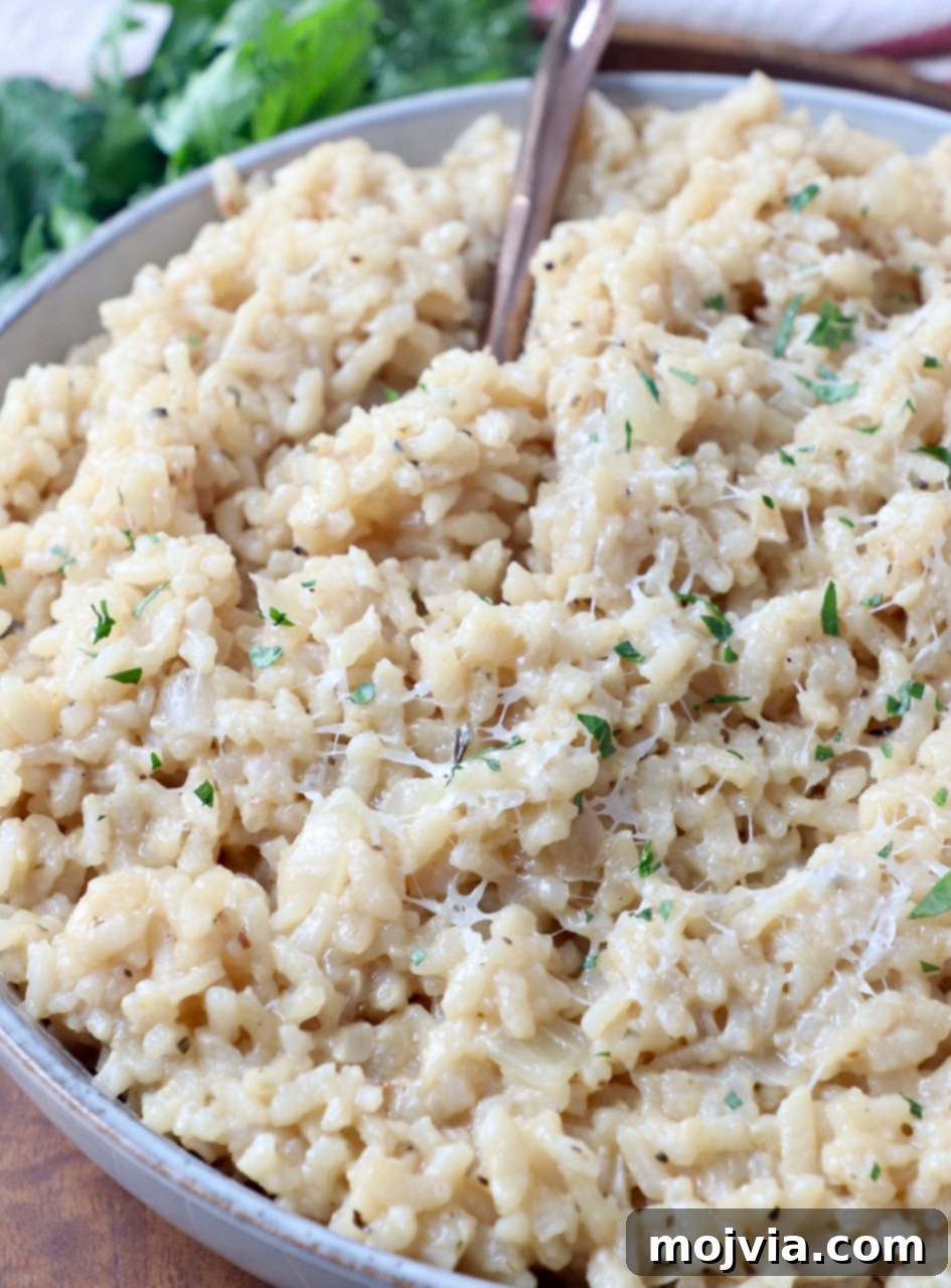Quick & Creamy Instant Pot Risotto 2 parmesan risotto in bowl with fork