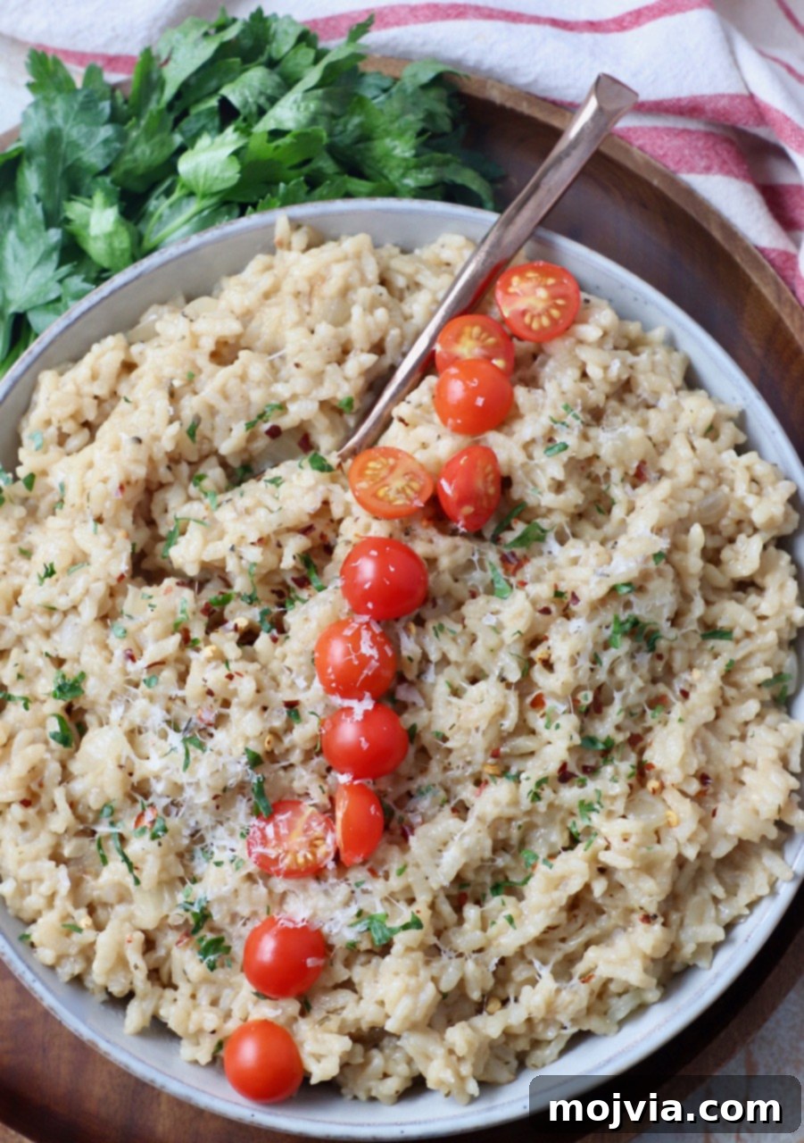 Quick & Creamy Instant Pot Risotto 11 risotto in bowl topped with halved cherry tomatoes