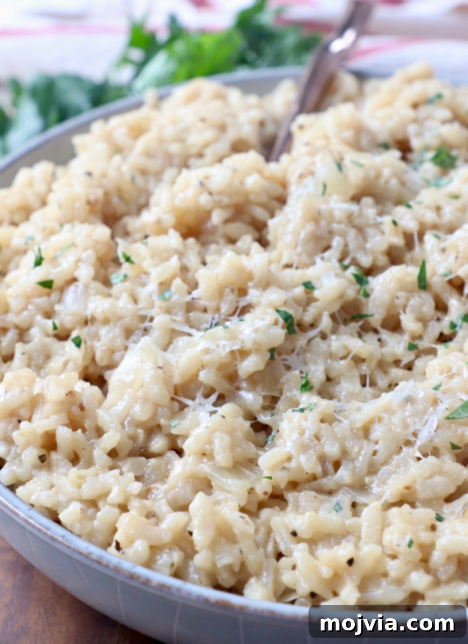 Quick & Creamy Instant Pot Risotto 12 parmesan risotto in bowl with fork