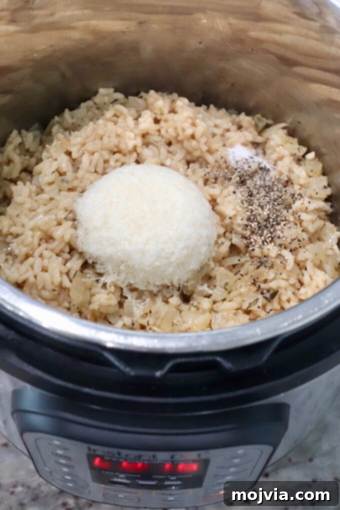 Quick & Creamy Instant Pot Risotto 9 cooked risotto in Instant Pot with parmesan cheese and seasonings