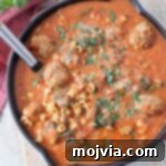 Ultimate Comfort Meatball Soup 10 meatball soup in skillet with serving spoon