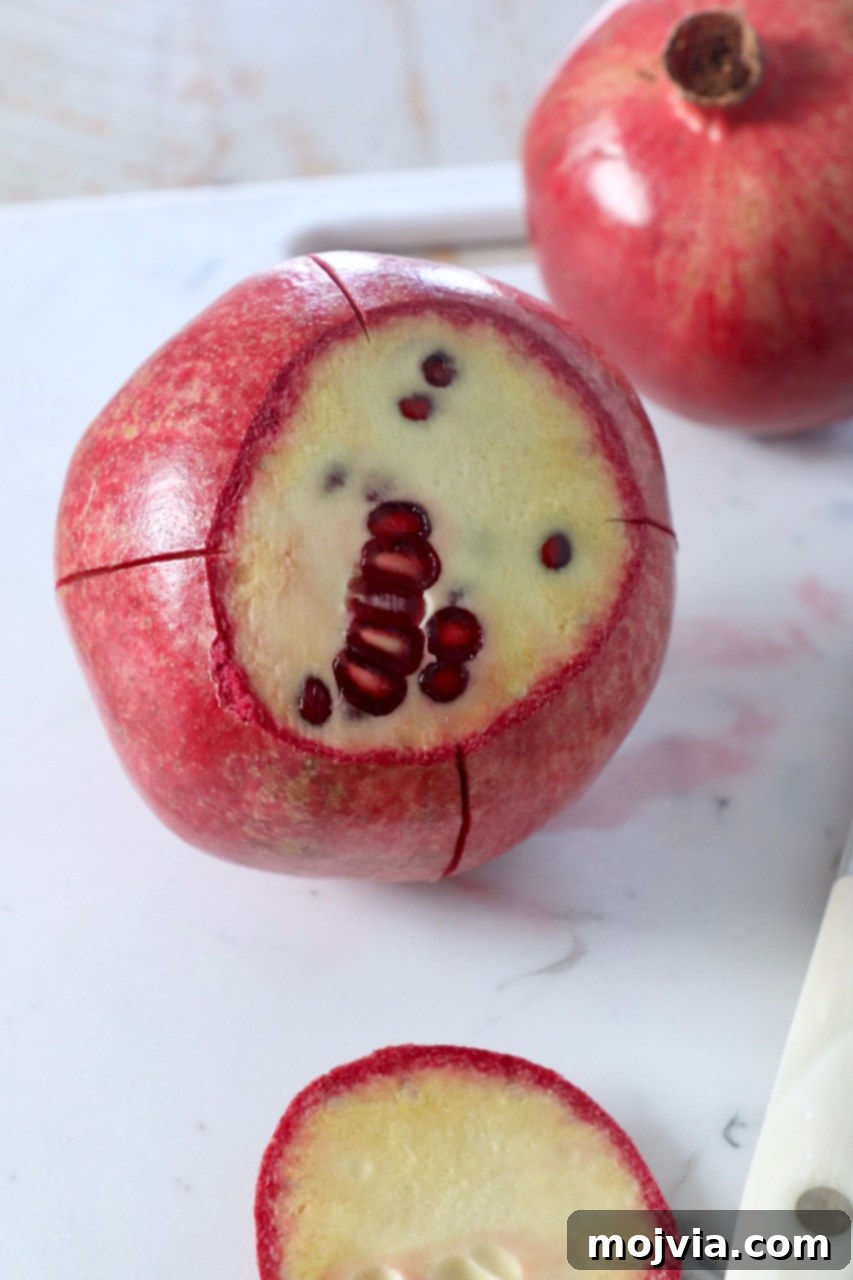 Pomegranate Secrets Revealed 3 fresh pomegranate cut on cutting board