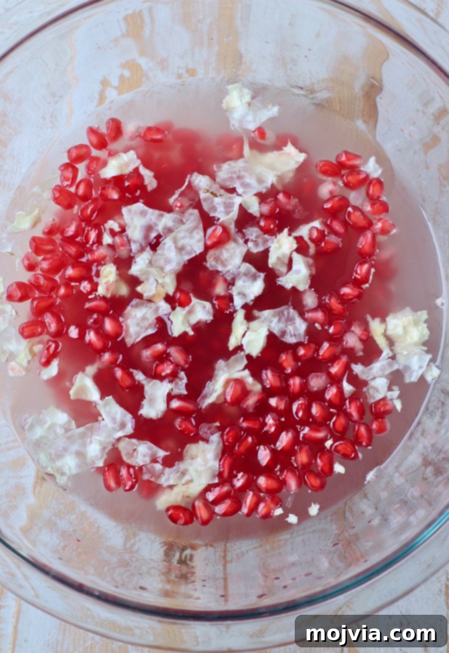 Pomegranate Secrets Revealed 5 pomegranate seeds in glass bowl of water