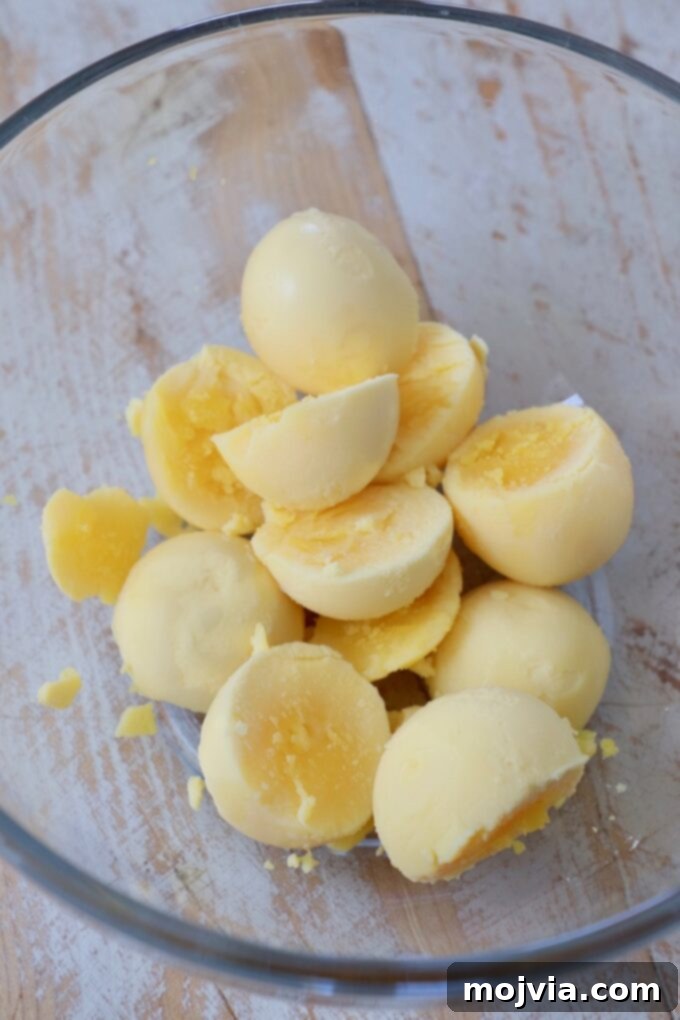 Family Favorite Deviled Eggs 5 hard boiled egg yolks in a glass bowl