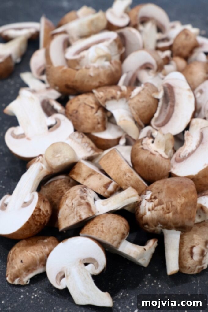 sliced mushrooms on cutting board