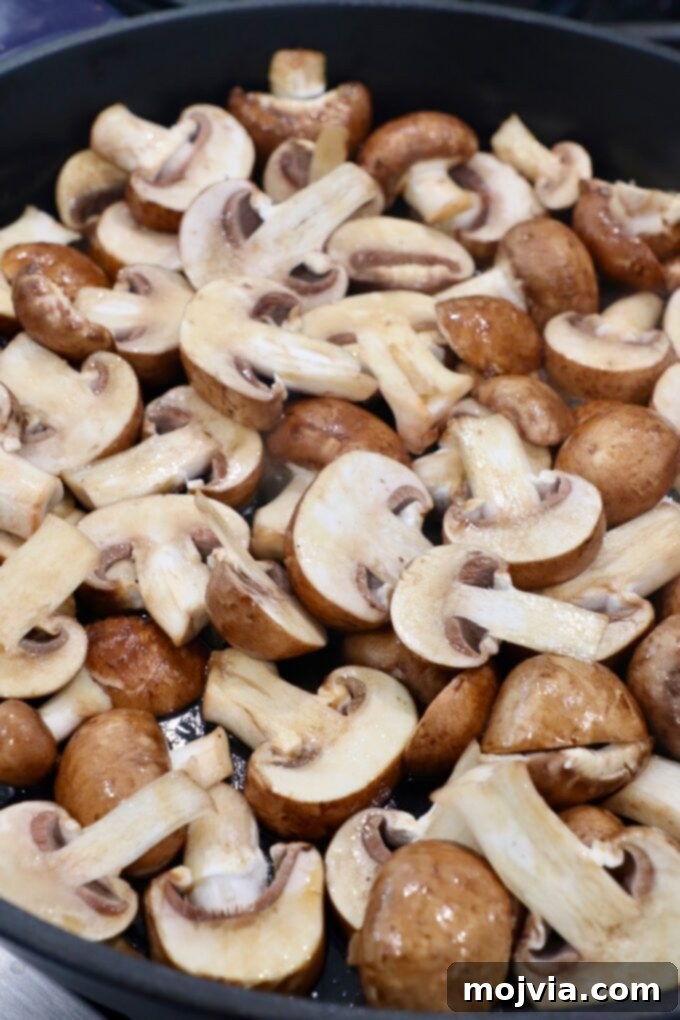 sliced mushrooms in skillet