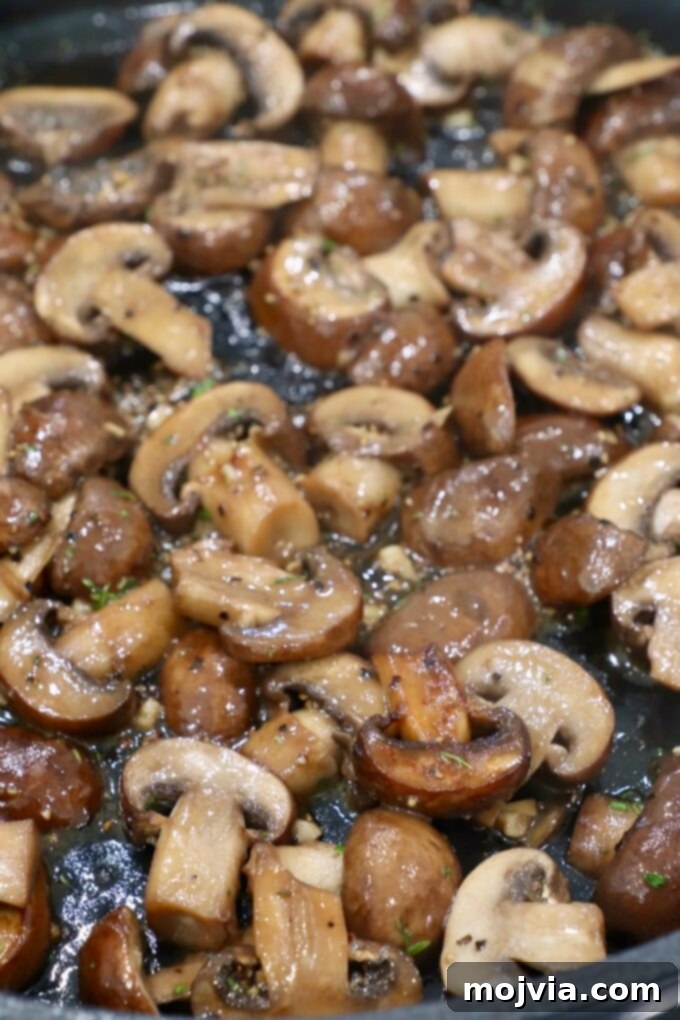 cooked sliced mushrooms in skillet