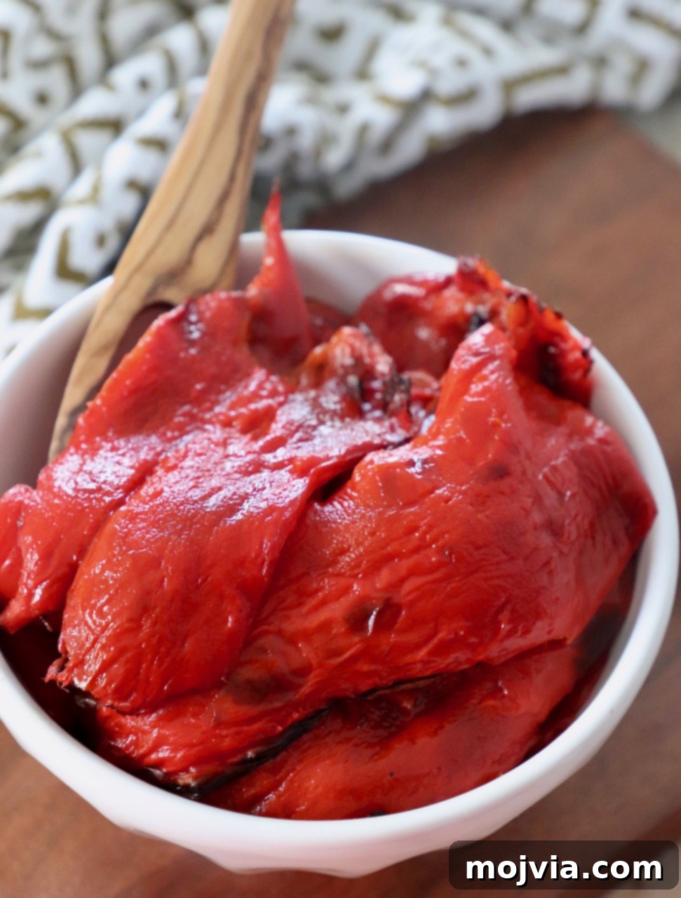Fire Kissed Red Peppers 2 A bowl of freshly roasted red peppers, beautifully charred and tender.