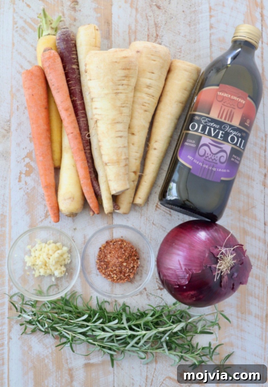 Earthy Harvest Roast 3 A selection of ingredients laid out for roasted root vegetables, including carrots, parsnips, onions, garlic, and fresh rosemary.