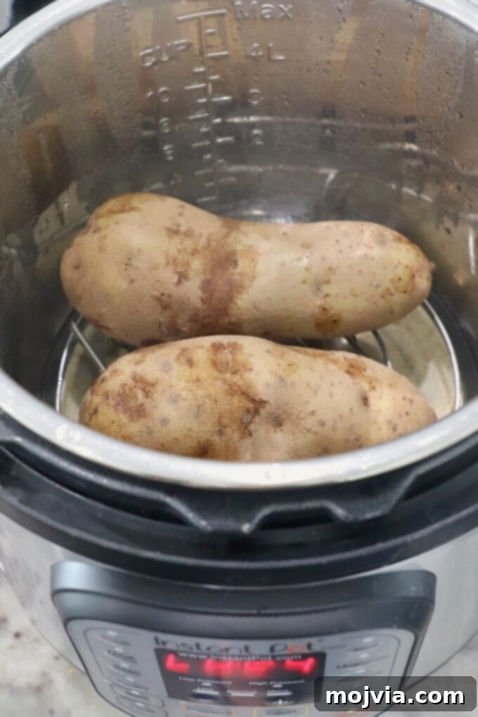 Perfect Instant Pot Baked Potatoes 5 Cooked large russet potatoes inside an Instant Pot