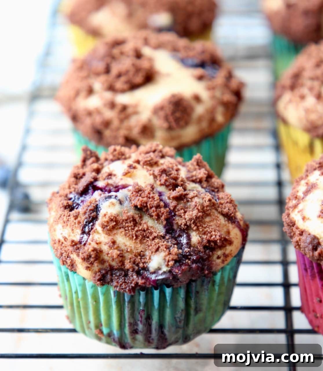 Delicious Blueberry Cream Cheese Muffins with Chocolate Crumble, freshly baked and ready to enjoy