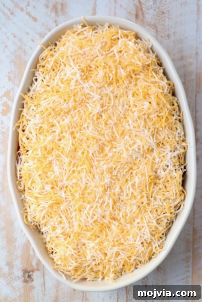 Sizzling Fajita Seven-Layer Dip 11 Generous layer of shredded cheese topping the dip